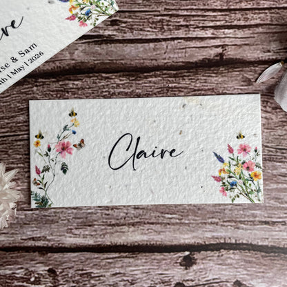 Name card with floral designs and &