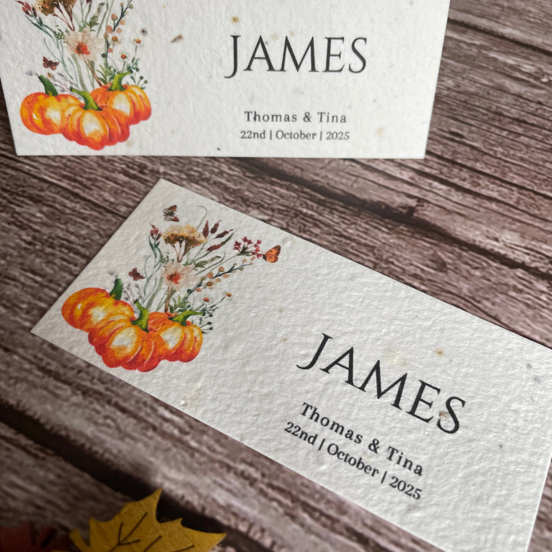 autumn seed paper place cards on a wooden surface
