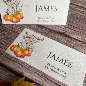 autumn seed paper place cards on a wooden surface