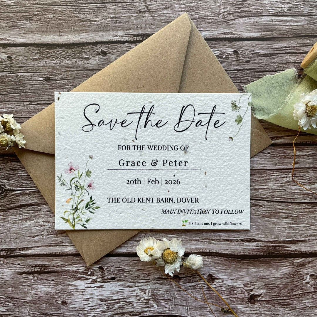 plantable seed paper wedding save the date card in spring green theme, with eco-friendly brown kraft envelope, floral design on wooden background.