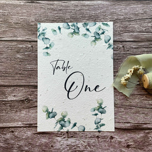 wedding table number or name cards with eucalyptus theme, front close-up view, eco-friendly wedding stationery, alakartcreations