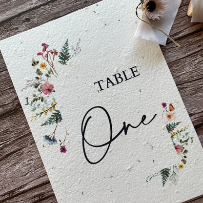 plantable seed paper wedding table number or name cards with wildflower meadow theme, angled view, eco-friendly wedding stationery, alakartcreations