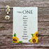 plantable seating plan with sunflowers design on a wooden background