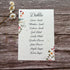 plantable seating plan with wildflower design on a wooden background