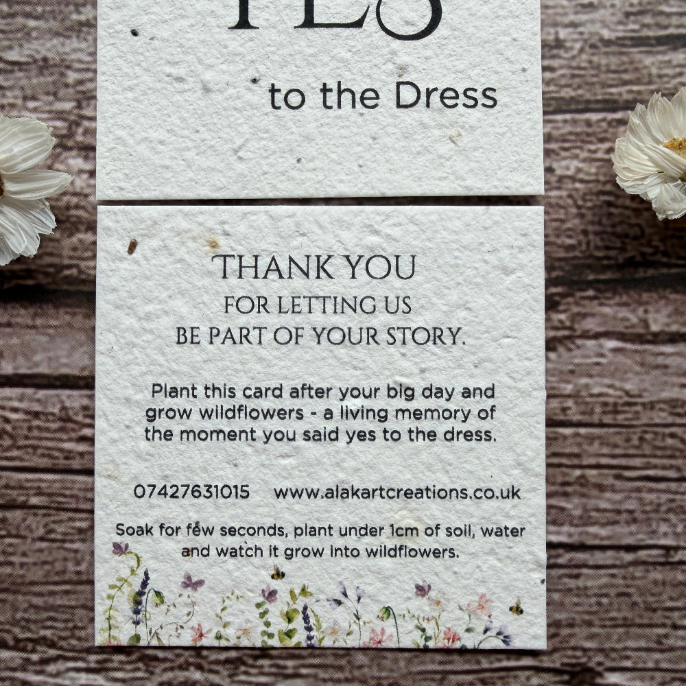 saying yes to dress card made of seed paper on wooden surafce