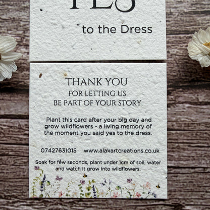 saying yes to dress card made of seed paper on wooden surafce