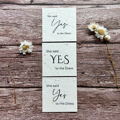 she said yes to the dress card collection on a wooden surface made of seed paper