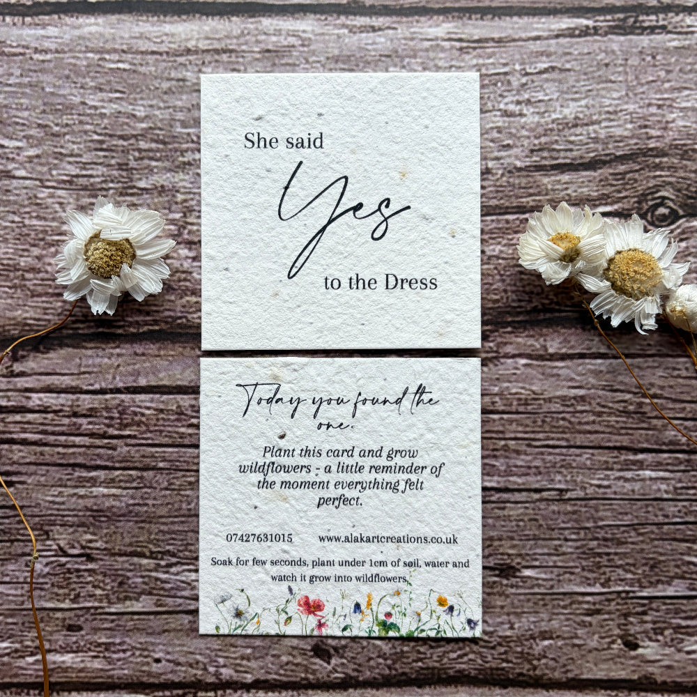 she said yes to the dress seed paper card on wooden background
