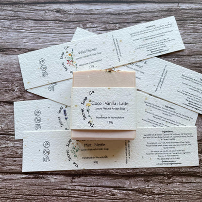 soap labels made with plantable seed paper laid on wooden background