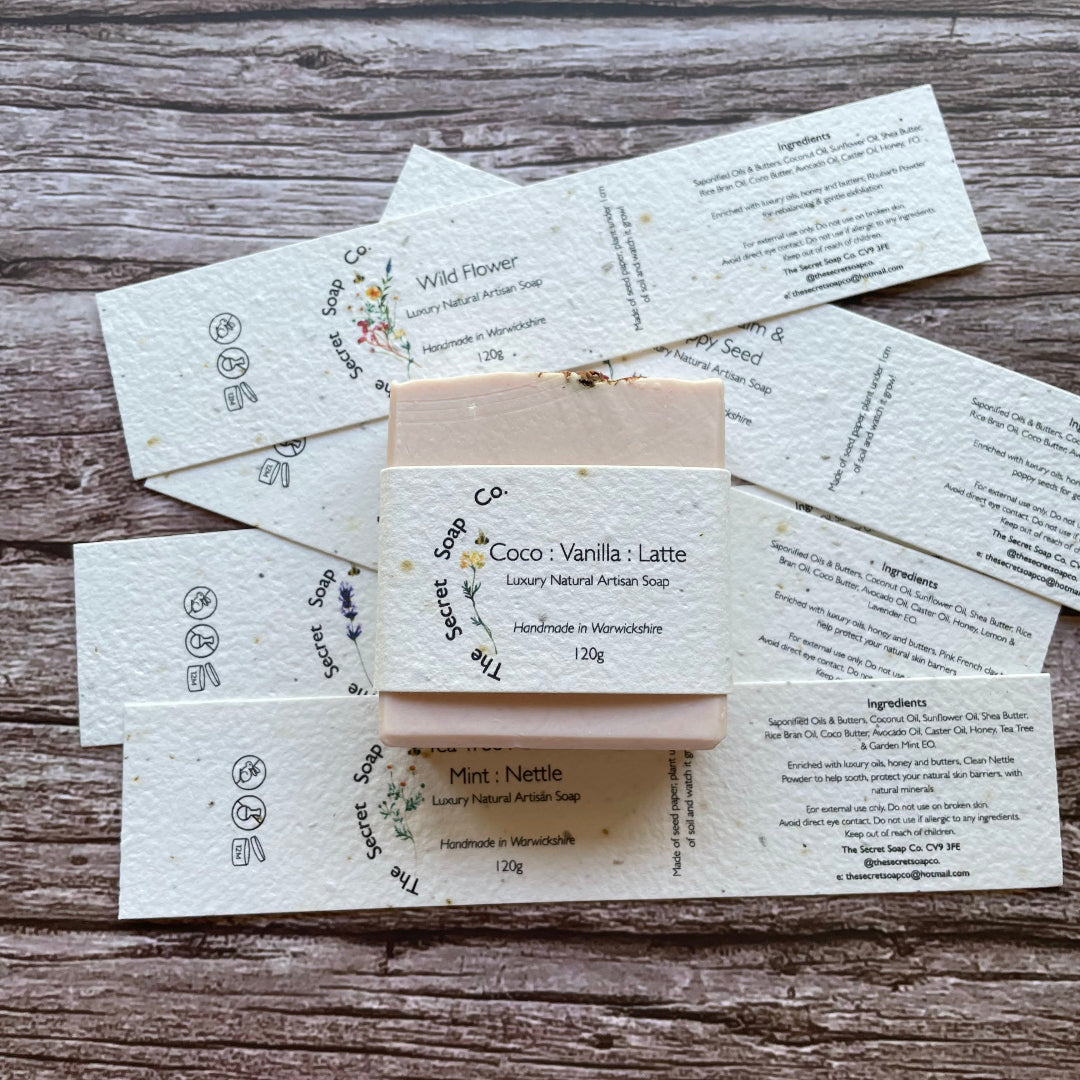 soap labels made with plantable seed paper laid on wooden background