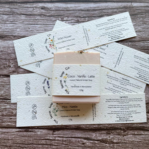 soap labels made with plantable seed paper laid on wooden background