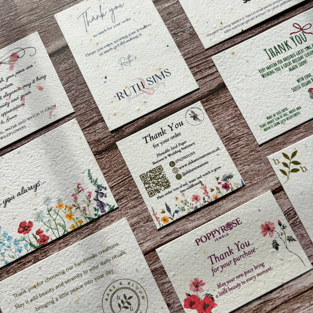 Collection of personalised plantable thank you for your order cards on a wooden surface