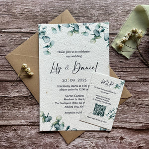 A personalised plantable wedding invitation with a eucalyptus design accompanied by a brown envelope and a QR code card for RSVP.