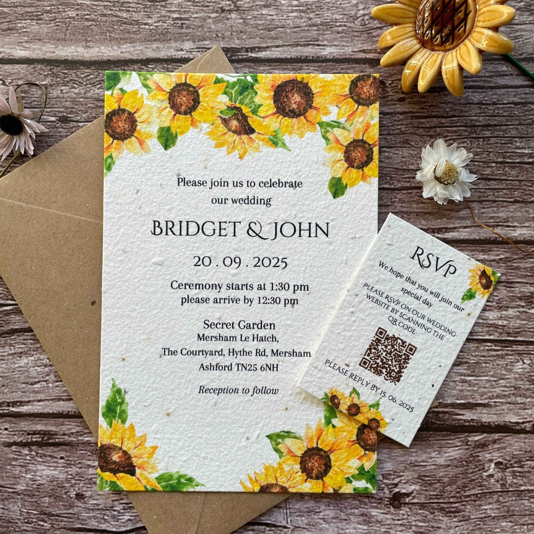 personalised plantable wedding invitations in sunflowers theme, front view with eco-friendly brown kraft envelope, qr code rsvp on wooden background.