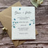 Plantable wedding invitation card with envelope on a wooden surface made of seed paper with a blue sweet pea design