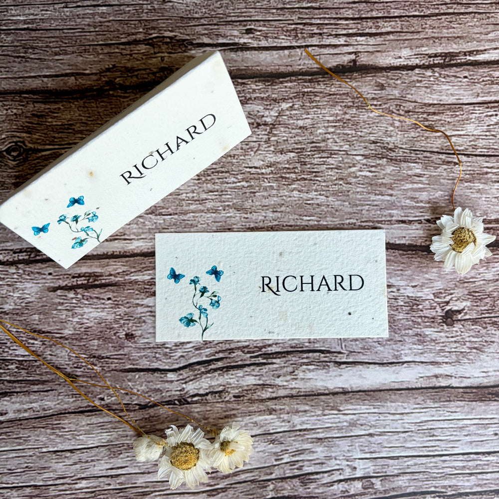 Two name cards with blue sweet peas designs and &