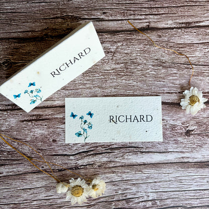 Two name cards with blue sweet peas designs and &
