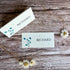 Two name cards with blue sweet peas designs and &