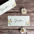 plantable wedding place cards with spring wildflowers on wooden surface