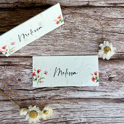 Two plantable place cards with sweet pea designs and &