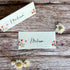 Two plantable place cards with sweet pea designs and &