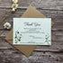 plantable wedding thank you card with clovers and bluebells on a wooden background