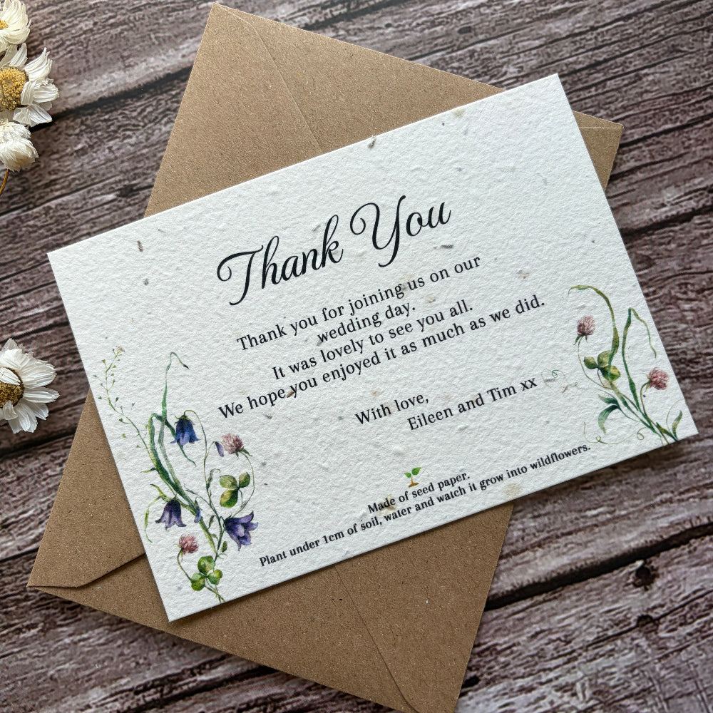 Plantable wedding Thank you card with floral design on a wooden surface