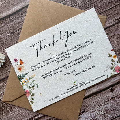 plantable wedding thank you card with wildflowers on a wooden background