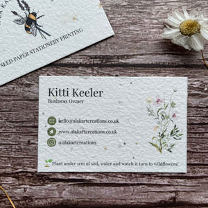 pre-designed plantable business cards with green logo and wildflowers, showcasing eco-friendly floral design and sustainable branding, alakartcreations