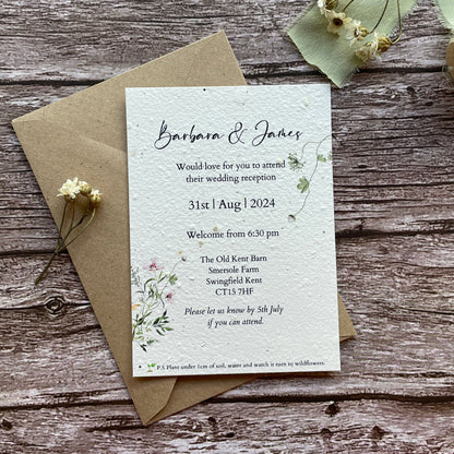 plantable seed paper botanical wedding reception invites on wooden surface
