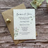plantable seed paper botanical wedding reception invites on wooden surface