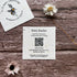 Plantable square business cards with bee design on a wooden surface with flowers