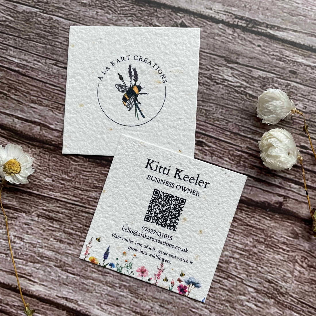 square plantable seed paper business cards with qr code, angled right, alakartcreations