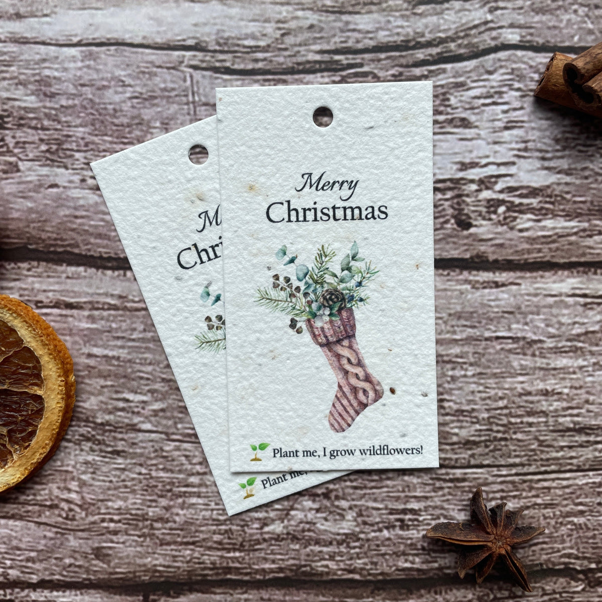 Close-up view of a single stocking plantable Christmas gift tag.