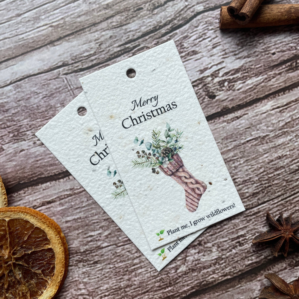Grouped stocking plantable seed paper Christmas gift tags.