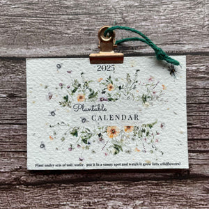 Front view of the 2025 Plantable Seed Paper wall Calendar, featuring the Summer Elegance design with vibrant floral illustrations.