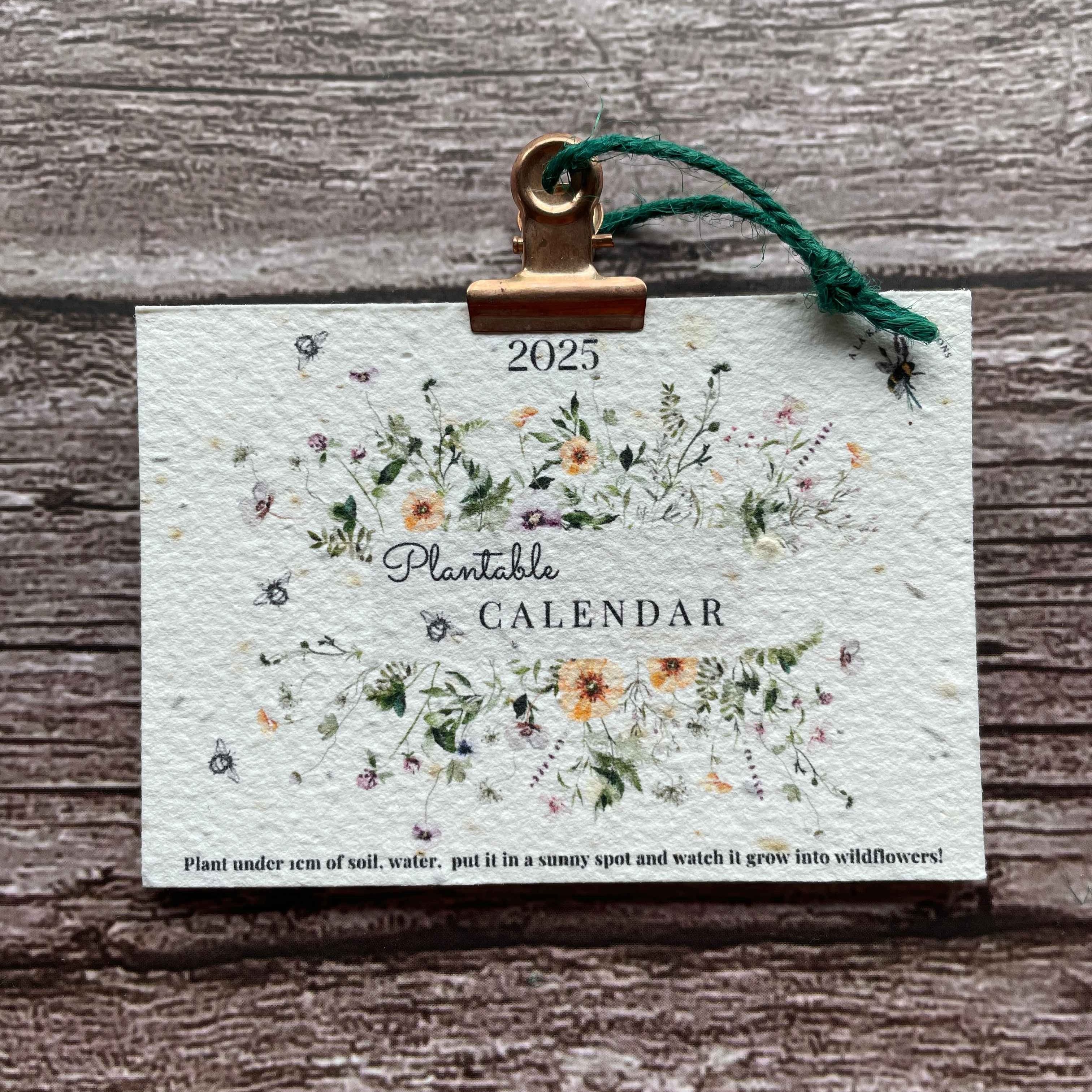 front view of the 2025 plantable seed paper wall calendar, featuring the summer elegance design with vibrant floral illustrations, alakartcreations