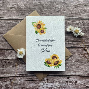 front view of personalised plantable sunflower mother's day card with message "the world is brighter because of you mum," handmade in the uk by a la kart creations