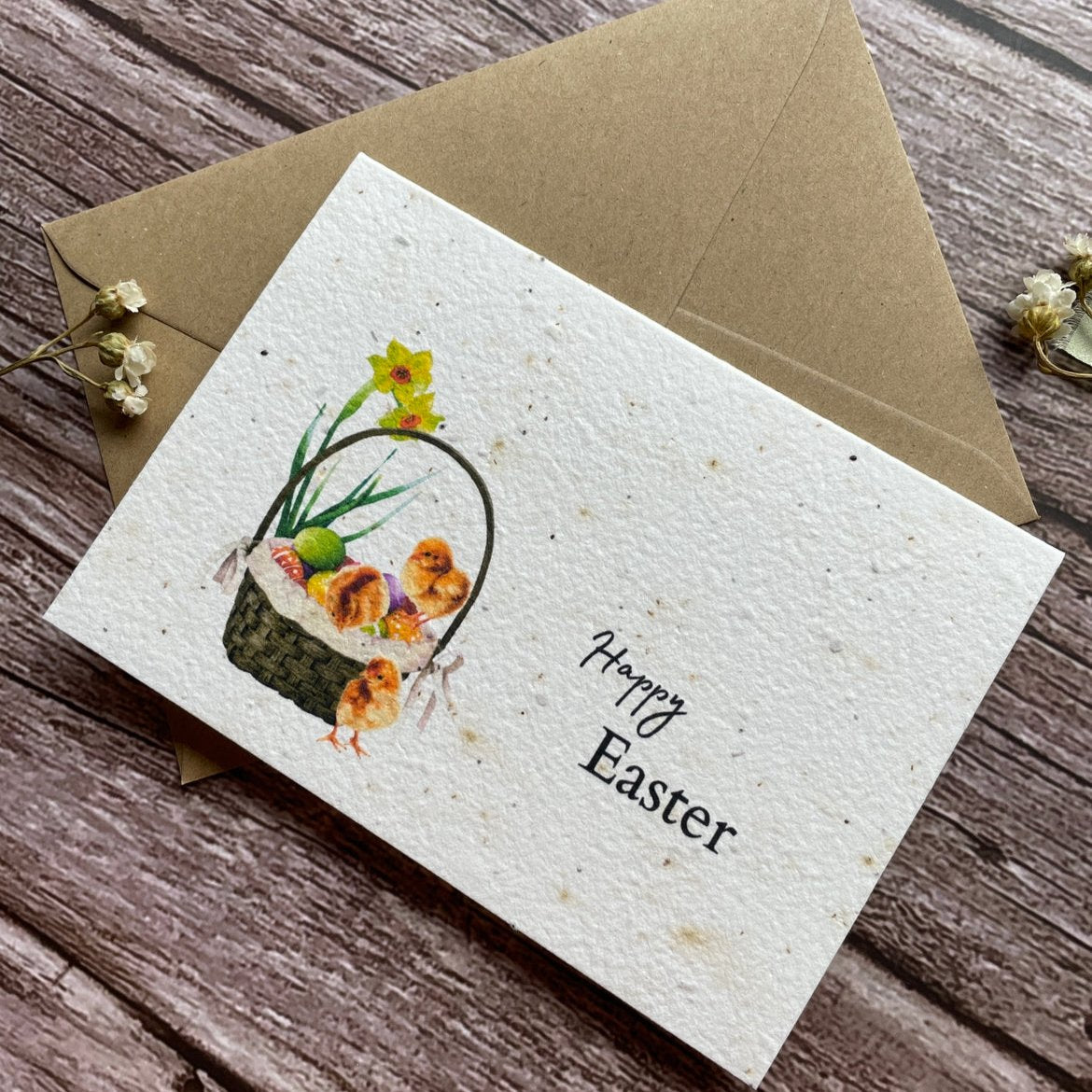 angled left view of plantable easter card with baby chicks, easter eggs, and wildflower paper, alakartcreations