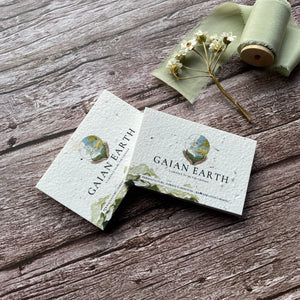 custom seed paper business cards overlapping at an angle, showcasing eco-friendly design and personalised branding, from a la kart creations