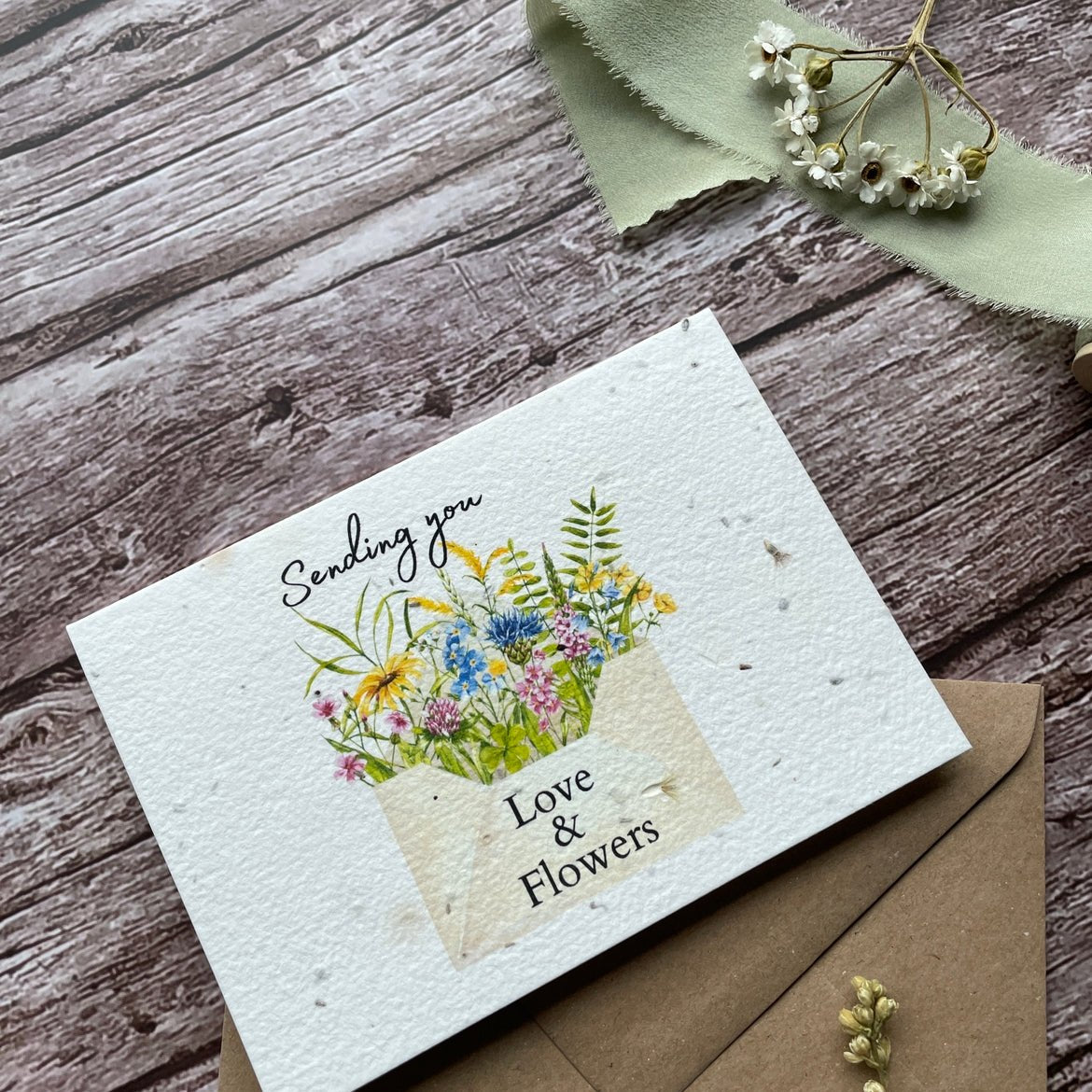 Angled left view of the Love and Flowers Letter Personalised Plantable Card highlighting the intricate details of the card.