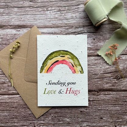Front view of the Love &amp; Hugs Rainbow Personalised Plantable Card featuring a colourful rainbow design.