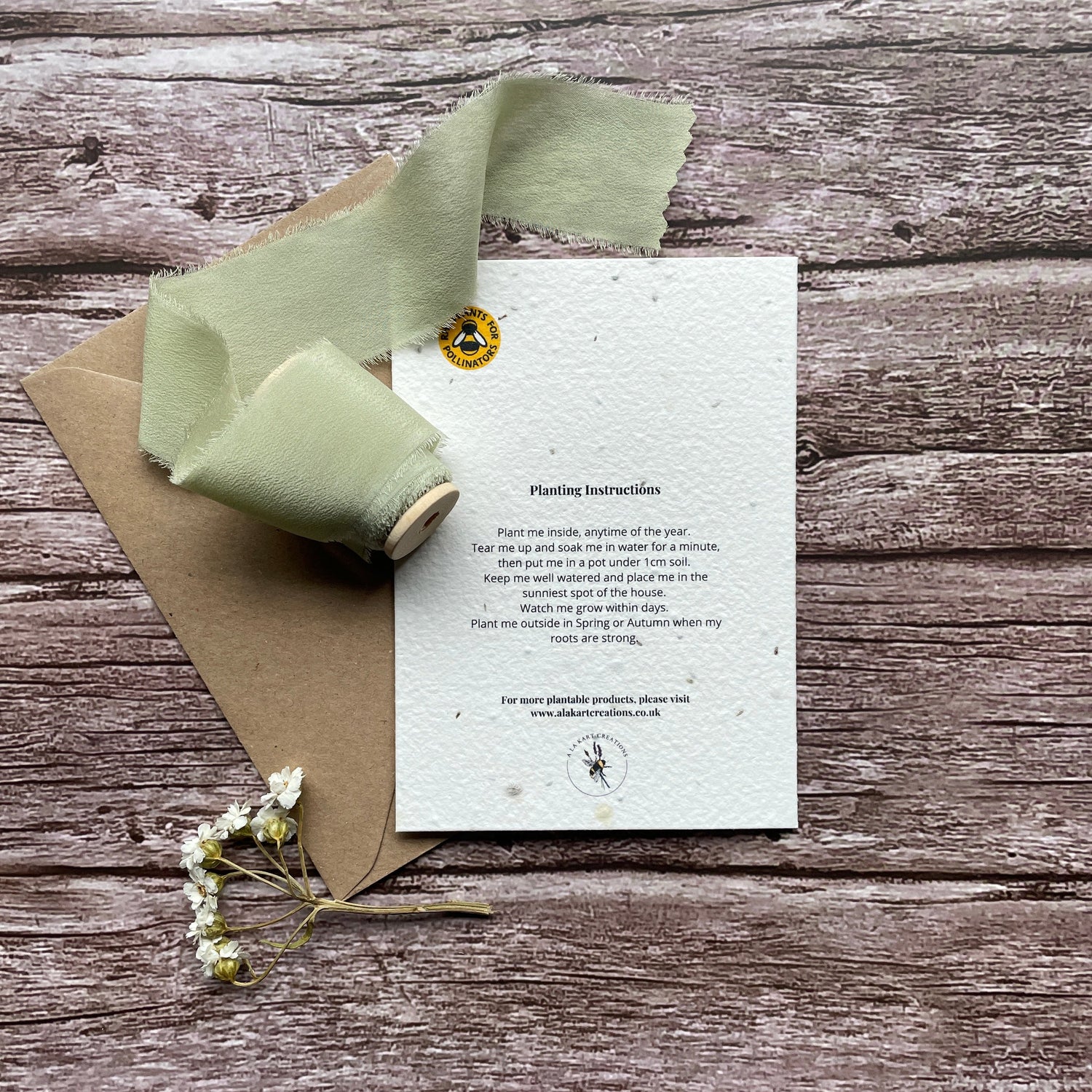 Back view of the Love &amp; Hugs Rainbow Personalised Plantable Card displaying essential information and branding.