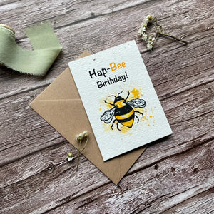 personalised plantable birthday card with hap-bee birthday design, angled view from the left, highlighting eco-friendly uk-made plantable seed paper, handmade, from alakartcreations