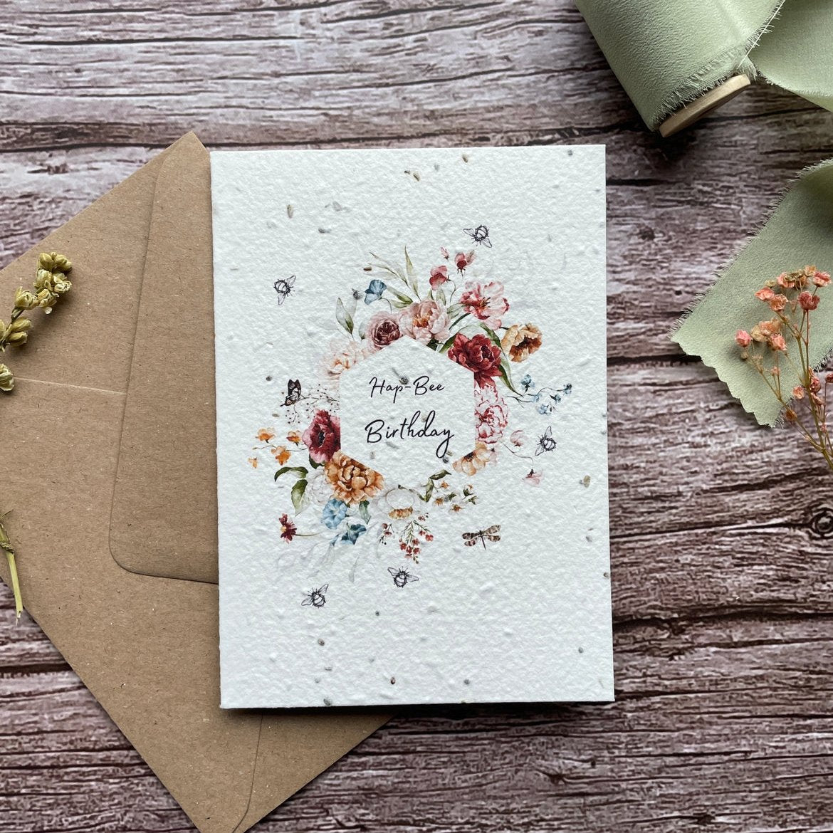 personalised buzzing bees plantable card with 'hap-bee birthday' text and small buzzing bees