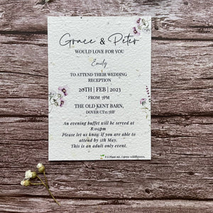 plantable evening guest wedding invitations in lilac theme, showing front view, floral design on wooden background, eco-friendly