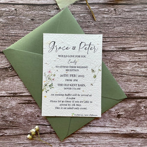 plantable evening guest wedding invitations in spring green theme, showing front view with colour matched envelope, floral design on wooden background