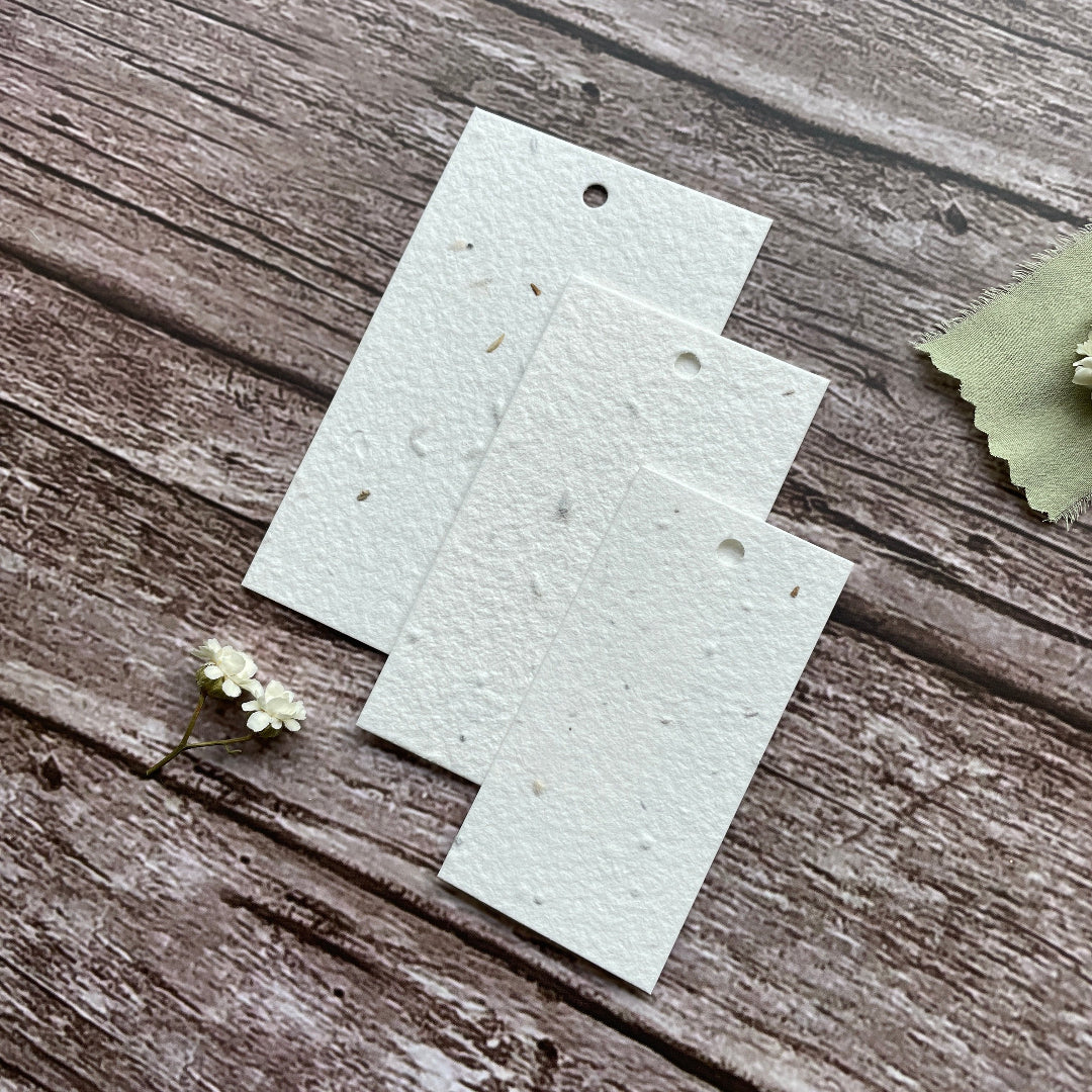 plantable seed paper product hang tags on wooden bakground
