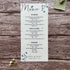 plantable seed paper wedding menu card in dusty blue theme, showing a close-up front view, floral design on wooden background, eco-friendly