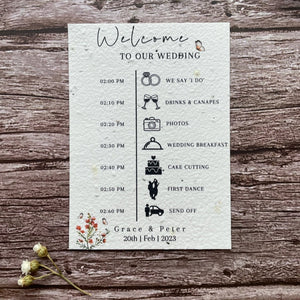 plantable seed paper wedding order of service card in burnt orange theme, showing front view, floral design on wooden background, eco-friendly